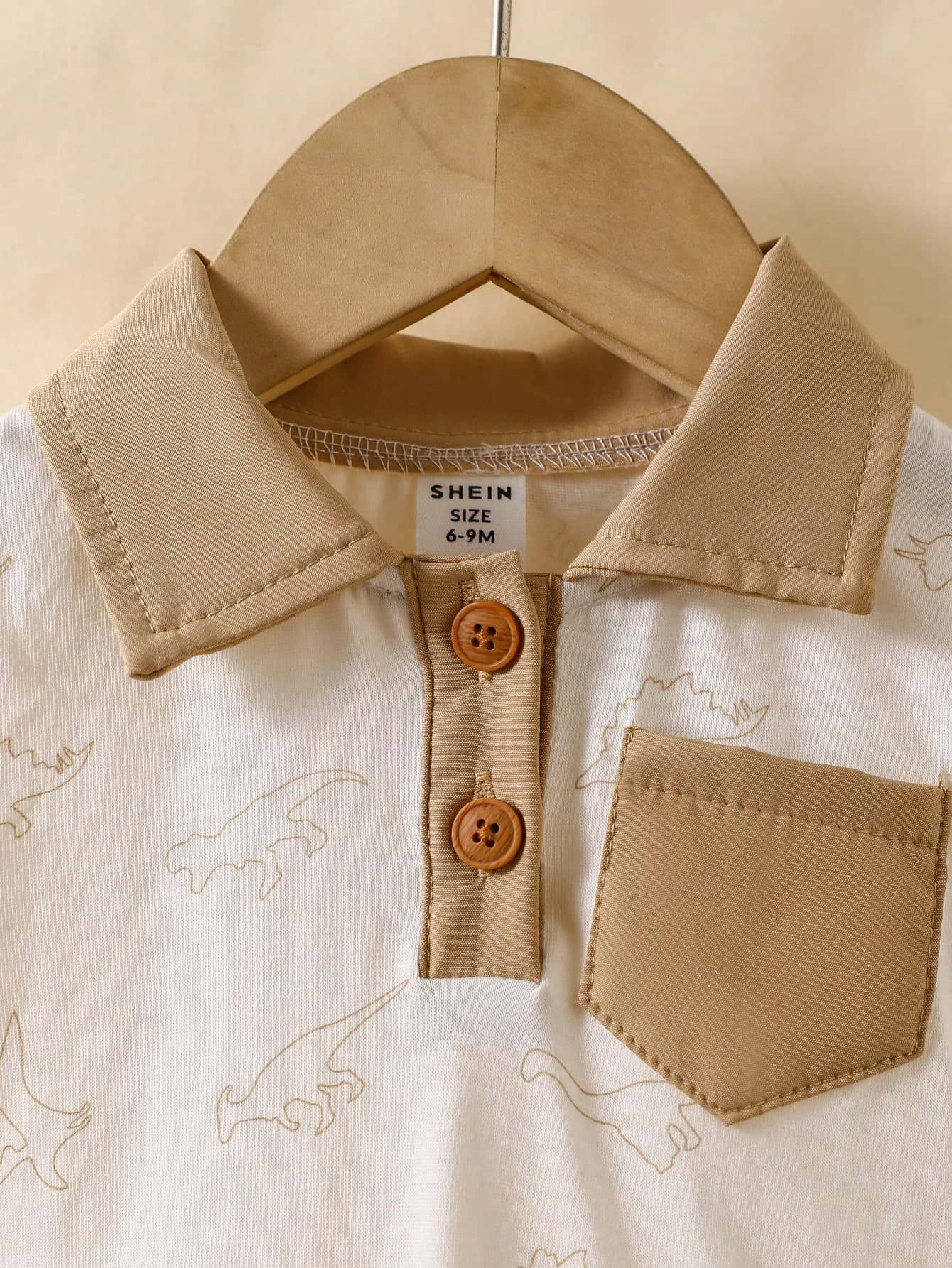 رومبير ولادي أبيض بطباعة خفيفة